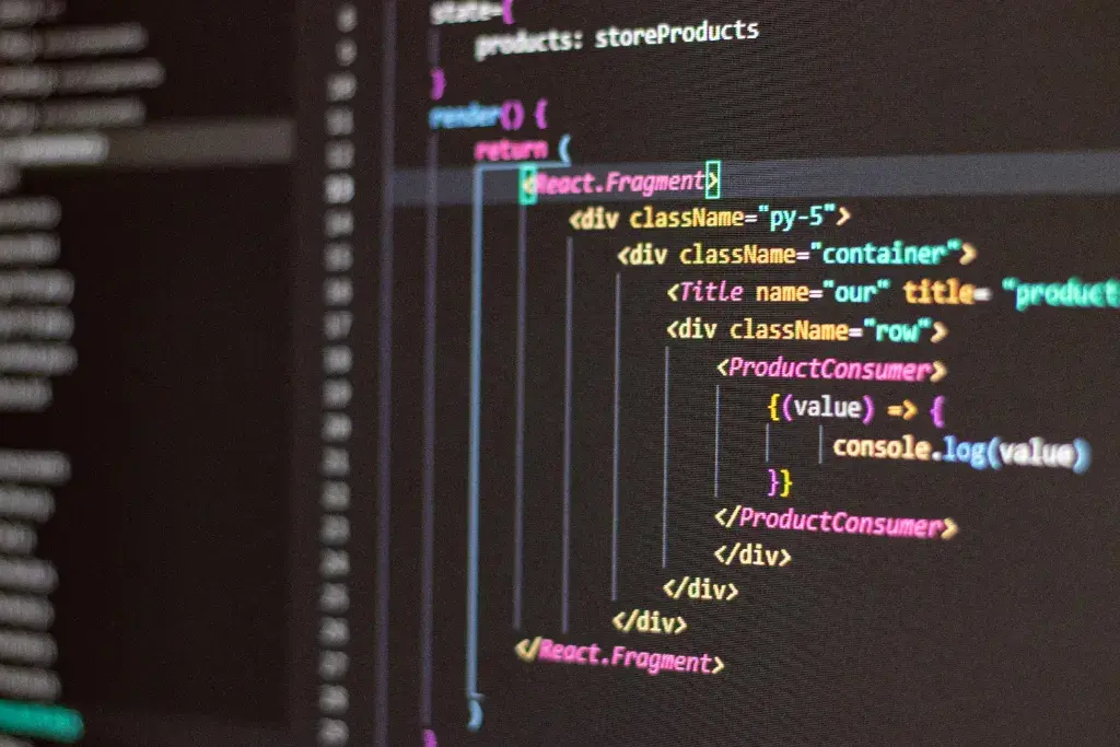 Close-up view of React JSX code on a computer monitor, illustrating professional coding and refactoring practices.